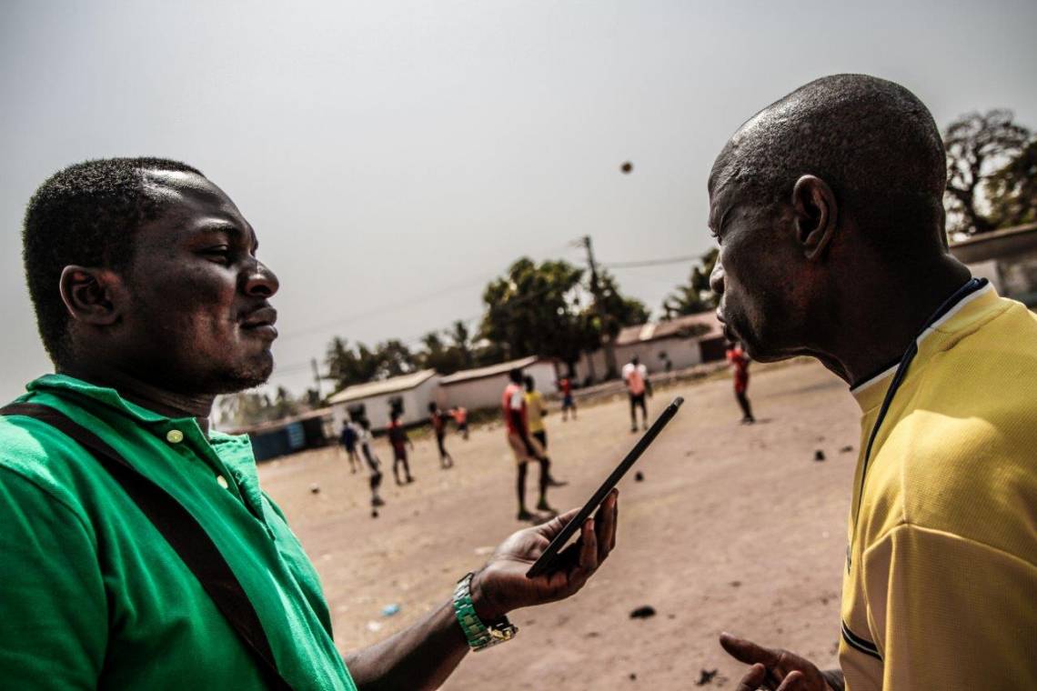 A journalist from Radio Ndeke Luka reporting in Bangui.