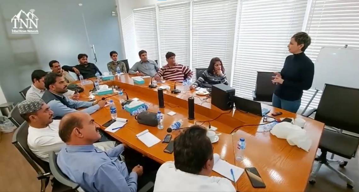 During a training session in Sindh province, with trainer Sabin Agha.