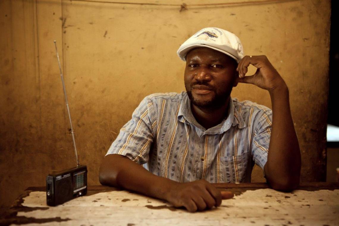 A radio listener in Kinshasa, Democratic Republic of the Congo.